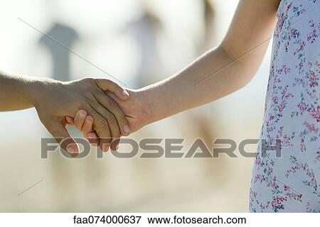 Children holding hands, cropped View Large Photo Image Stock Photo - Children holding hands, cropped. Fotosearch