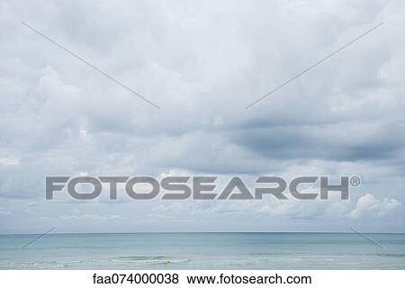 Cloudy sky over ocean View Large Photo Image Stock Photo - Cloudy sky over ocean. Fotosearch