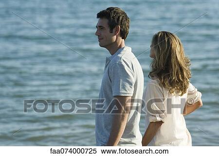 Couple looking at sea View Large Photo Image Stock Photography - Couple looking at sea. Fotosearch