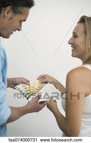 Couple picking color from color swatch View Large Photo Image Stock Image - Couple picking color from color swatch. Fotosearch