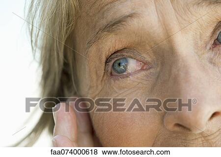 Stock Photo - Eye of senior woman, cropped. Fotosearch