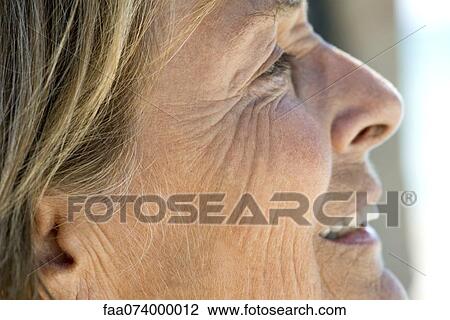 Stock Image - Face of senior woman, cropped. Fotosearch