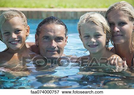 Family in swimming pool, portrait View Large Photo Image Stock Photo - Family in swimming pool, portrait. Fotosearch