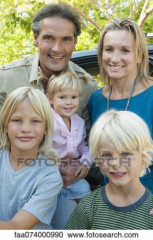 Family posing together outdoors, portrait View Large Photo Image Stock Image - Family posing together outdoors, portrait. Fotosearch