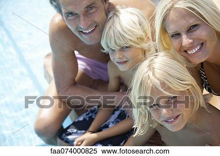 Family sitting together beside swimming pool, portrait View Large Photo Image Stock Photography - Family sitting together beside swimming pool, portrait. Fotosearch