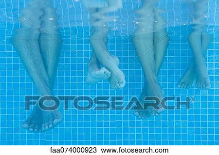 Family soaking feet in pool, underwater view View Large Photo Image Stock Image - Family soaking feet in pool, underwater view. Fotosearch
