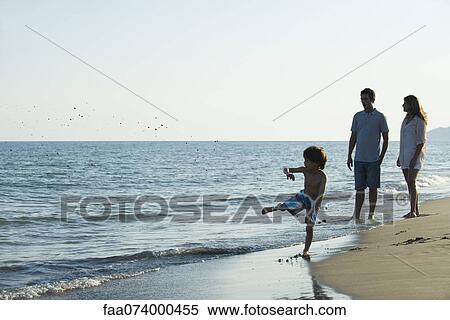 Family together at the beach View Large Photo Image Stock Photography - Family together at the beach. Fotosearch