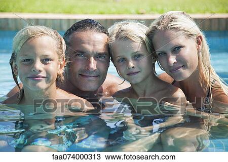 Family together in pool, portrait View Large Photo Image Stock Image - Family together in pool, portrait. Fotosearch