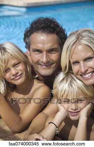 Family together in swimming pool, portrait View Large Photo Image Stock Photography - Family together in swimming pool, portrait. Fotosearch