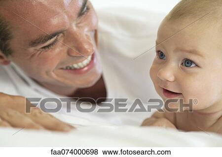 Father and baby bonding View Large Photo Image Stock Photo - Father and baby bonding. Fotosearch