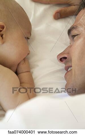 Father bonding with baby View Large Photo Image Stock Image - Father bonding with baby. Fotosearch