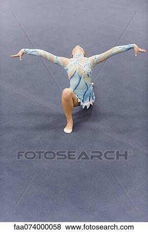 Female gymnast performing floor routine View Large Photo Image Stock Photo - Female gymnast performing floor routine. Fotosearch