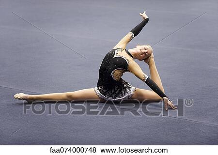 Female gymnast performing floor routine View Large Photo Image Stock Photo - Female gymnast performing floor routine. Fotosearch
