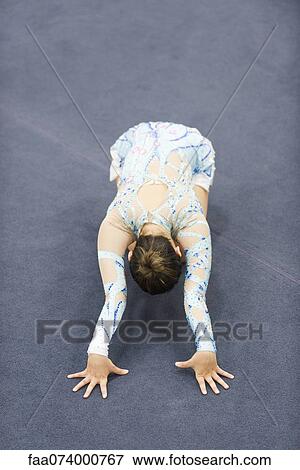 Female gymnast performing floor routine View Large Photo Image Stock Photo - Female gymnast performing floor routine. Fotosearch