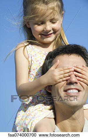 Girl covering father's eyes with her hands View Large Photo Image Stock Image - Girl covering father's eyes with her hands. Fotosearch