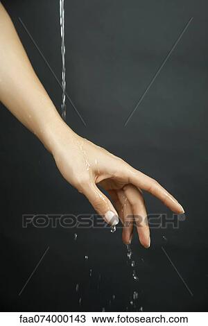 Hand under running water View Large Photo Image Stock Image - Hand under running water. Fotosearch