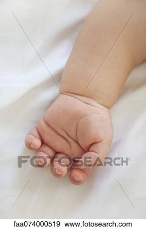 Stock Photo - Infant's hand. Fotosearch