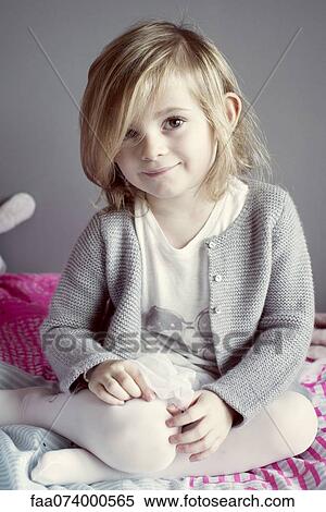 Little girl sitting, portrait View Large Photo Image Stock Photography - Little girl sitting, portrait. Fotosearch