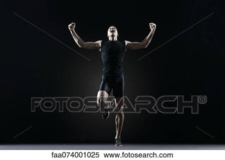 Male athlete flexing arms and shouting View Large Photo Image Stock Photography - Male athlete flexing arms and shouting. Fotosearch