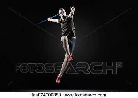 Male athlete leaping with javelin View Large Photo Image Stock Photo - Male athlete leaping with javelin. Fotosearch