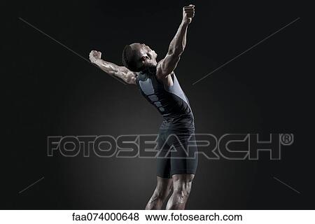 Male athlete shouting in celebratory way View Large Photo Image Stock Photo - Male athlete shouting in celebratory way. Fotosearch