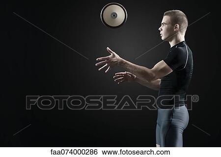 Male athlete throwing discus in air View Large Photo Image Stock Photograph - Male athlete throwing discus in air. Fotosearch