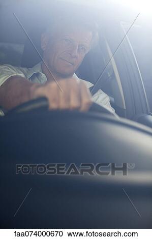 Man driving car, portrait View Large Photo Image Stock Image - Man driving car, portrait. Fotosearch