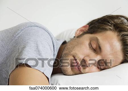 Stock Image - Man sleeping. Fotosearch