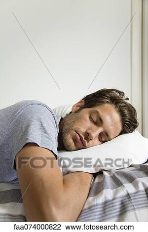 Stock Image - Man sleeping. Fotosearch