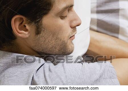 Stock Photo - Man sleeping. Fotosearch