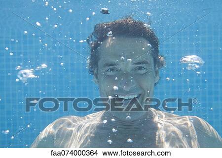 Picture - Man underwater, portrait. Fotosearch