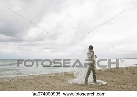 Man wrapped in plastic on beach View Large Photo Image Stock Photography - Man wrapped in plastic on beach. Fotosearch