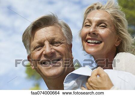 Picture - Mature couple outdoors, portrait. Fotosearch