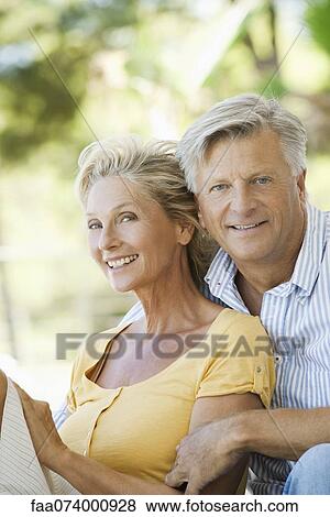 Mature couple together outdoors, portrait View Large Photo Image Stock Photo - Mature couple together outdoors, portrait. Fotosearch