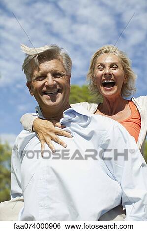 Mature couple together outdoors, portrait View Large Photo Image Stock Photograph - Mature couple together outdoors, portrait. Fotosearch