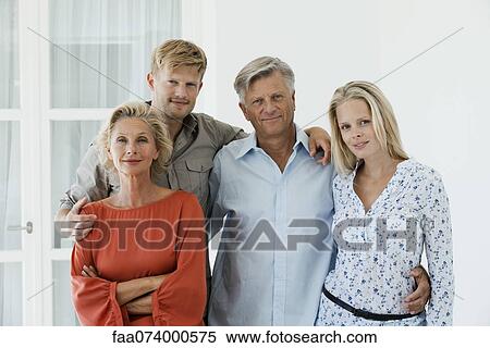 Stock Photography - Mature parents with their adult son and daughter, portrait. Fotosearch