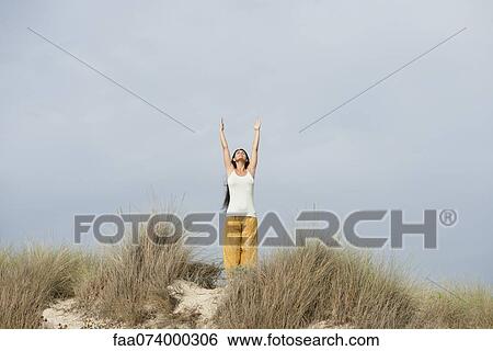 Mature woman doing sun salutation yoga pose View Large Photo Image Stock Photograph - Mature woman doing sun salutation yoga pose. Fotosearch
