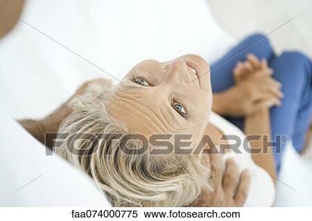 Mature woman getting a shoulder massage View Large Photo Image Stock Photography - Mature woman getting a shoulder massage. Fotosearch