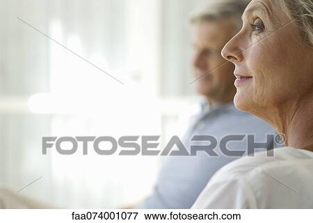 Mature woman looking away in thought View Large Photo Image Stock Photo - Mature woman looking away in thought. Fotosearch