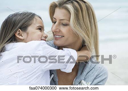 Mother and daughter looking at each other, portrait View Large Photo Image Stock Image - Mother and daughter looking at each other, portrait. Fotosearch