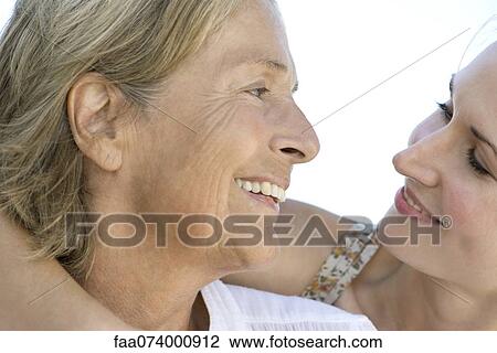 Mother looking at adult daughter View Large Photo Image Stock Image - Mother looking at adult daughter. Fotosearch
