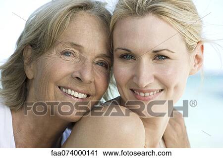 Stock Image - Mother with adult daughter, portrait. Fotosearch