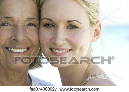 Stock Photo - Mother with adult daughter, portrait. Fotosearch