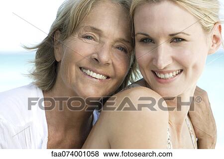 Stock Photo - Mother with adult daughter, portrait. Fotosearch