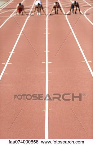 Running track, athletes at starting line in distance View Large Photo Image Stock Photograph - Running track, athletes at starting line in distance. Fotosearch