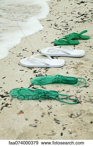 Sandals left on beach View Large Photo Image Stock Photo - Sandals left on beach. Fotosearch