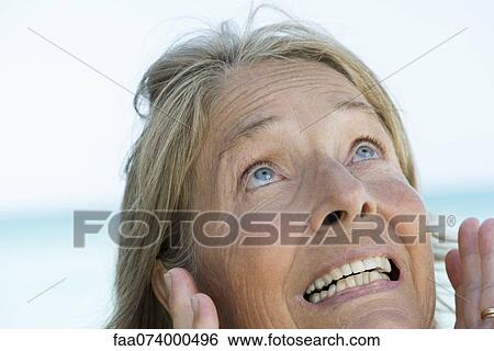 Senior woman making surprised face, portrait View Large Photo Image Stock Photograph - Senior woman making surprised face, portrait. Fotosearch