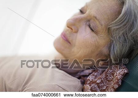 Senior woman napping View Large Photo Image Stock Image - Senior woman napping. Fotosearch