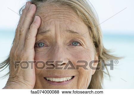 Senior woman with embarrassed expression View Large Photo Image Stock Photo - Senior woman with embarrassed expression. Fotosearch