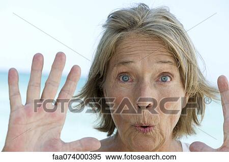Senior woman with hands raised in stop gesture View Large Photo Image Stock Photography - Senior woman with hands raised in stop gesture. Fotosearch